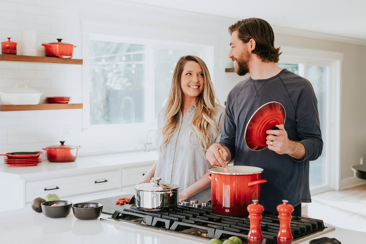 a couple preparing a valentine's meal